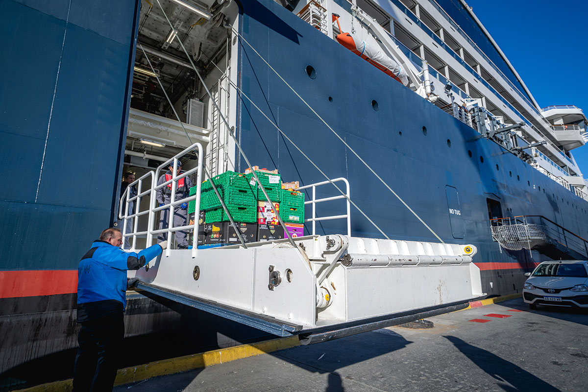 Agent showing supplies on a ship.