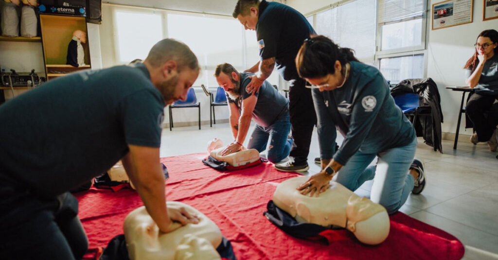 Multiple Delver Agent employees giving CPR to dummy dolls.